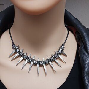 Punk necklace with spikes and runes on adjustable leather cord